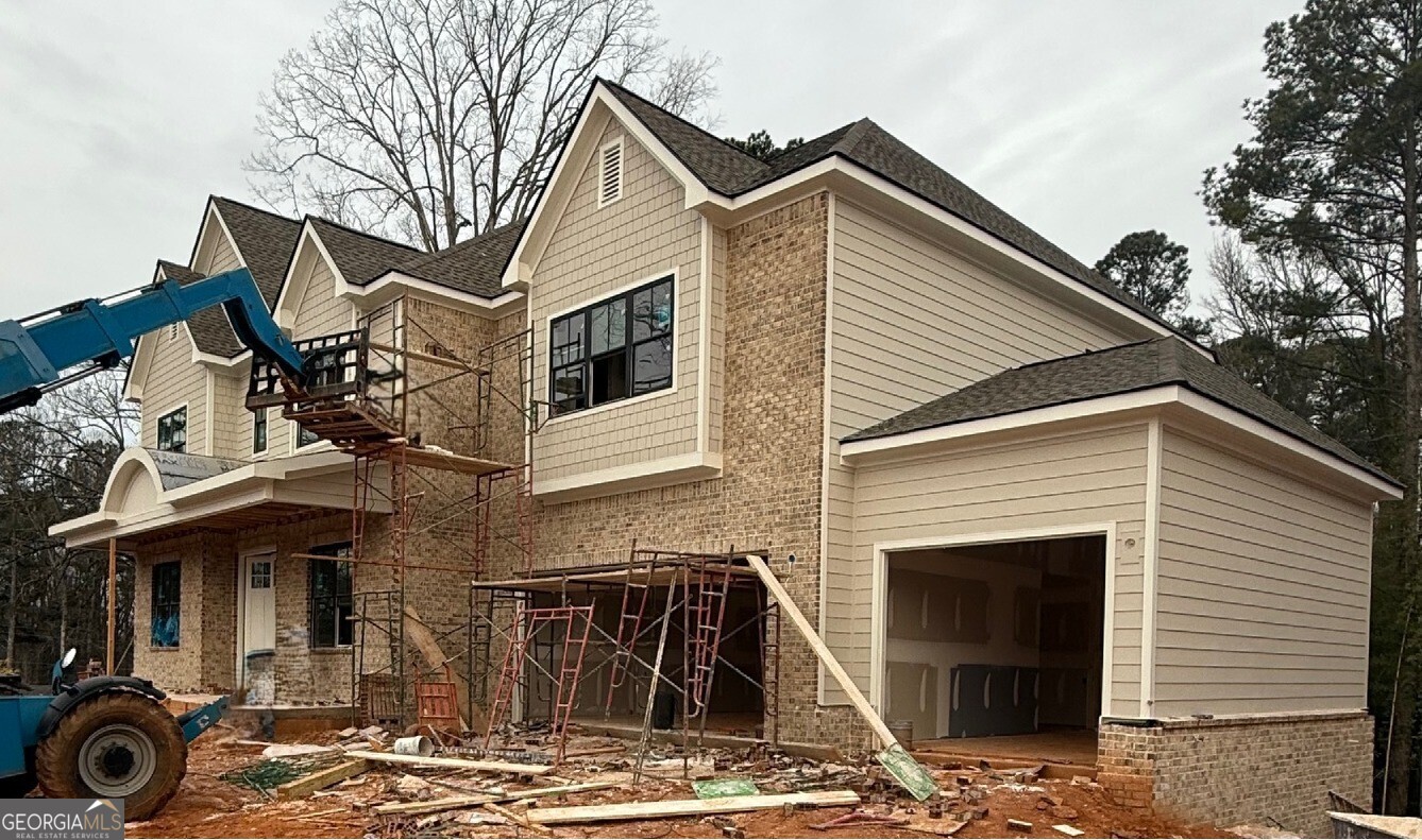 1976 Highgrove Court Atlanta, GA 30349 - Photo 2 of 48 a front view of a house with parking space