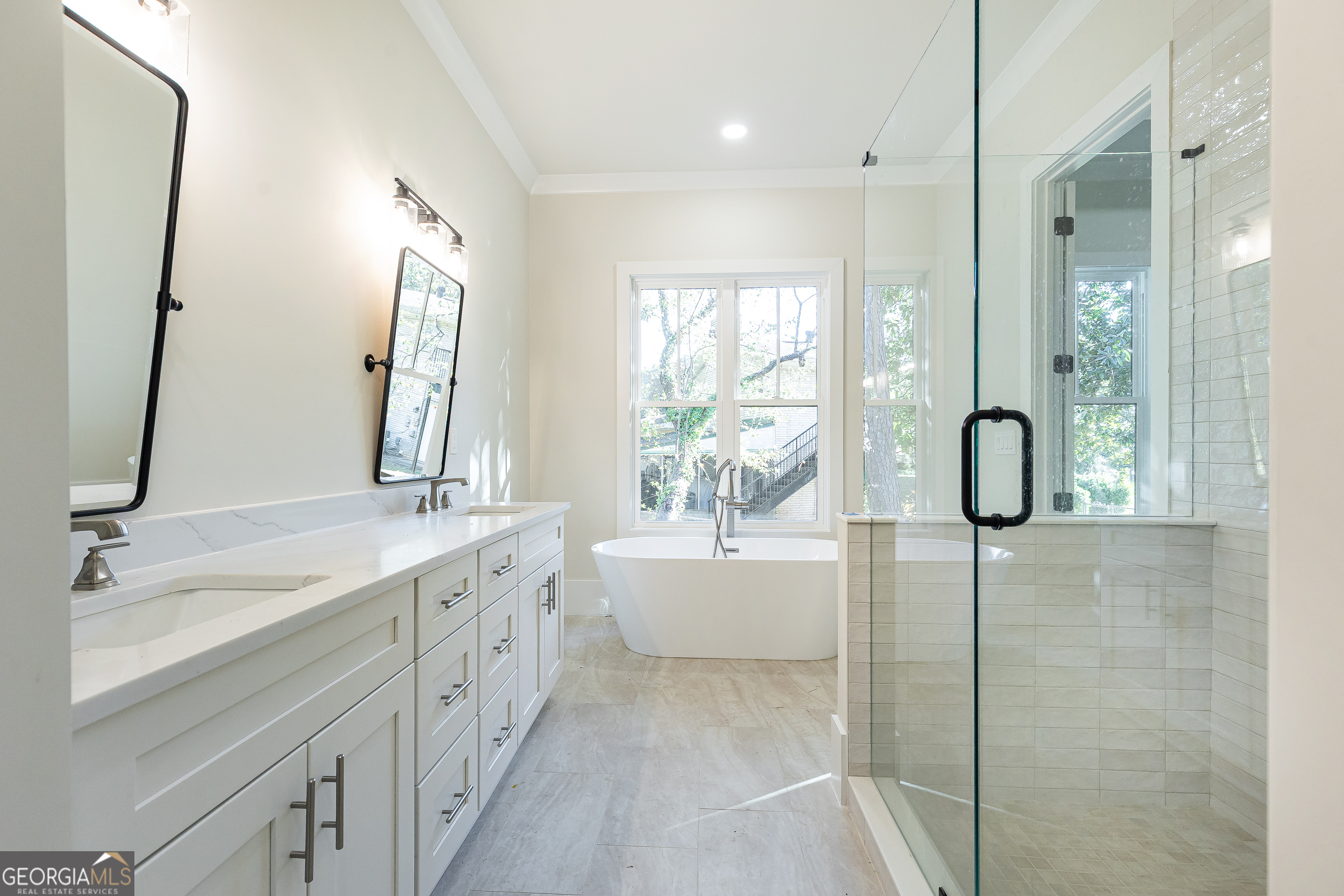 1976 Highgrove Court Atlanta, GA 30349 - Photo 27 of 48 a bathroom with a double vanity sink mirror and double