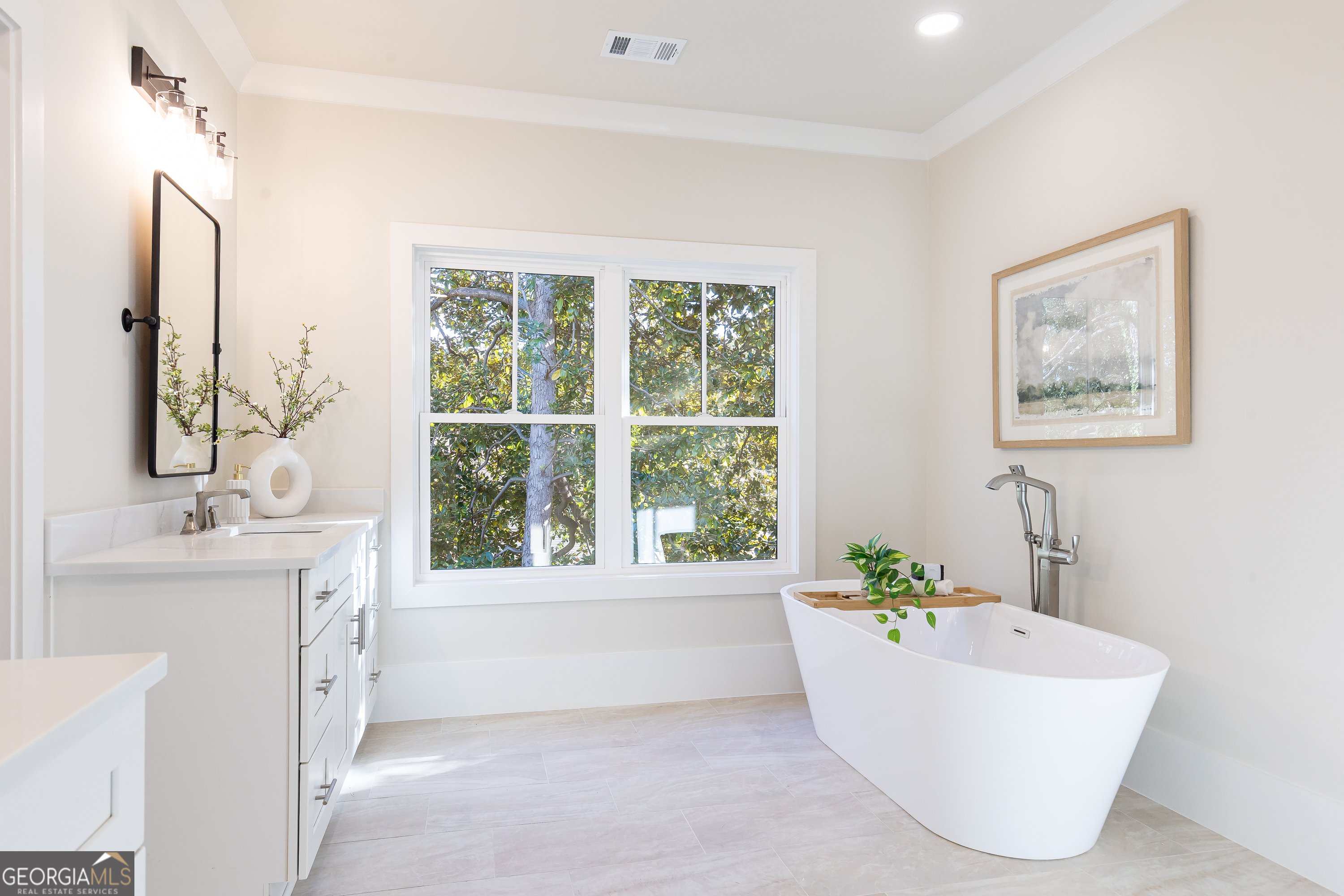 1976 Highgrove Court Atlanta, GA 30349 - Photo 31 of 48 a bathroom with a tub a sink and a large mirror