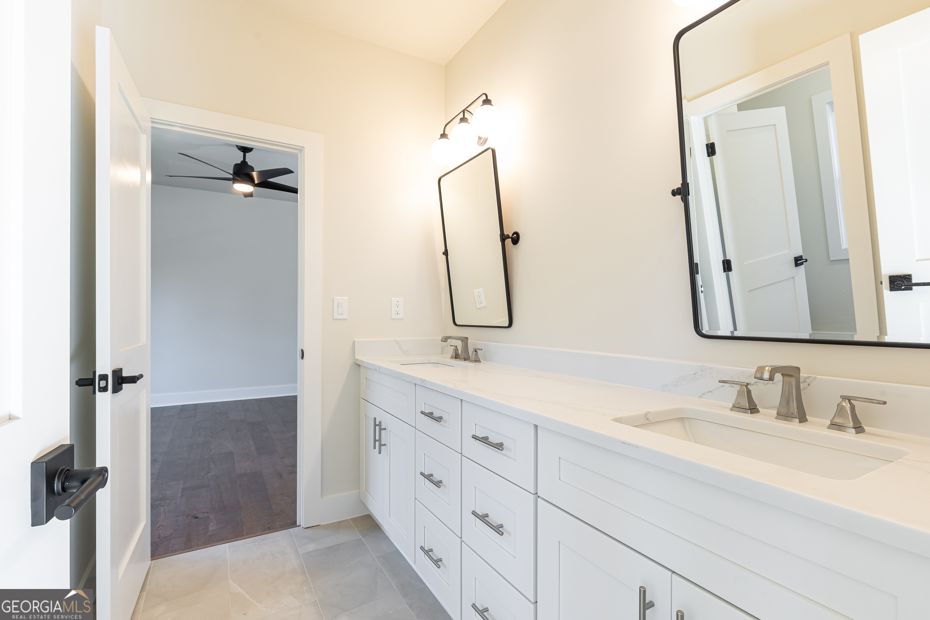 1976 Highgrove Court Atlanta, GA 30349 - Photo 40 of 48 a bathroom with a double vanity sink mirror and