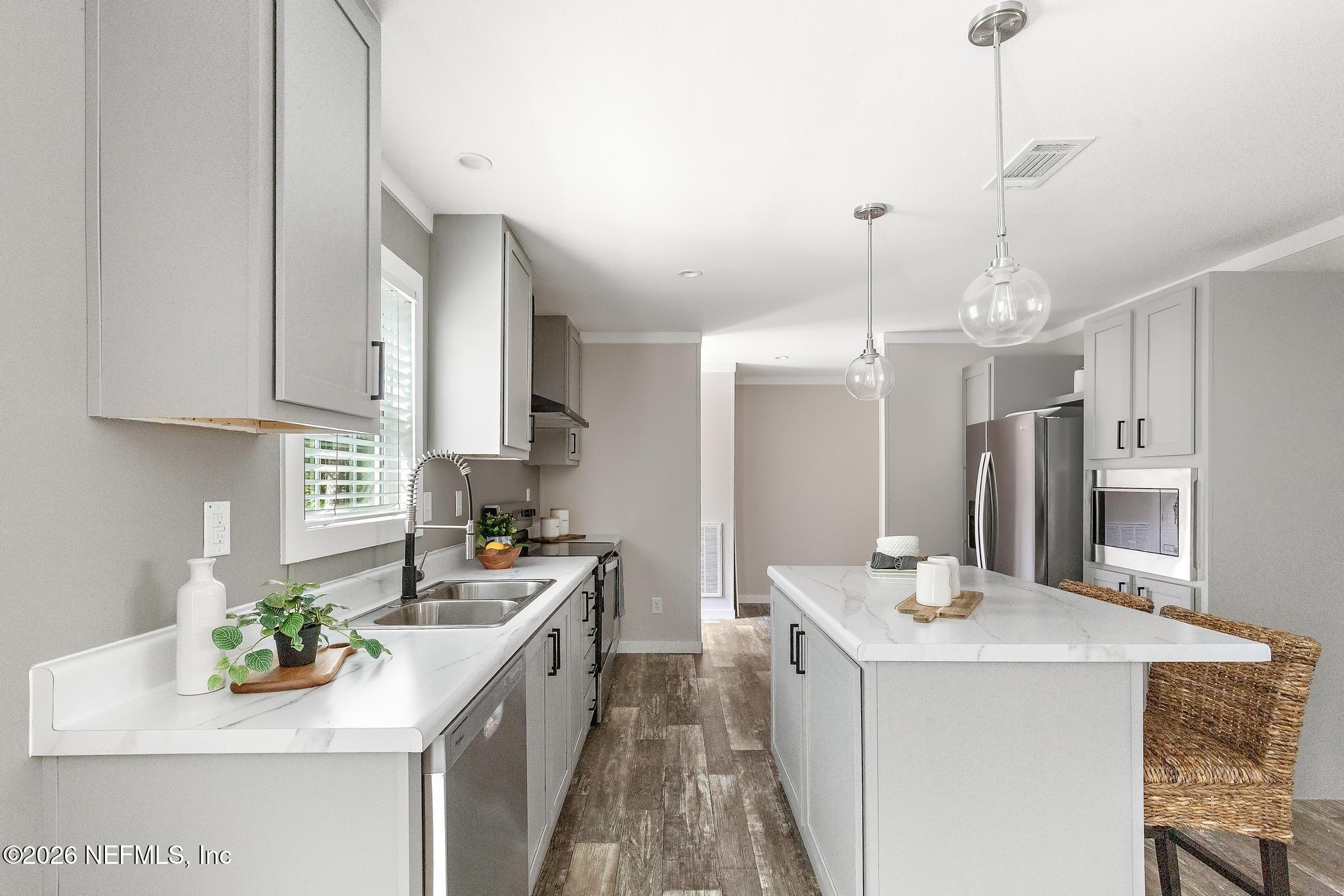 5333 Chicory Circle Middleburg, FL 32068 - Photo 20 of 53 a kitchen with a sink stove and refrigerator