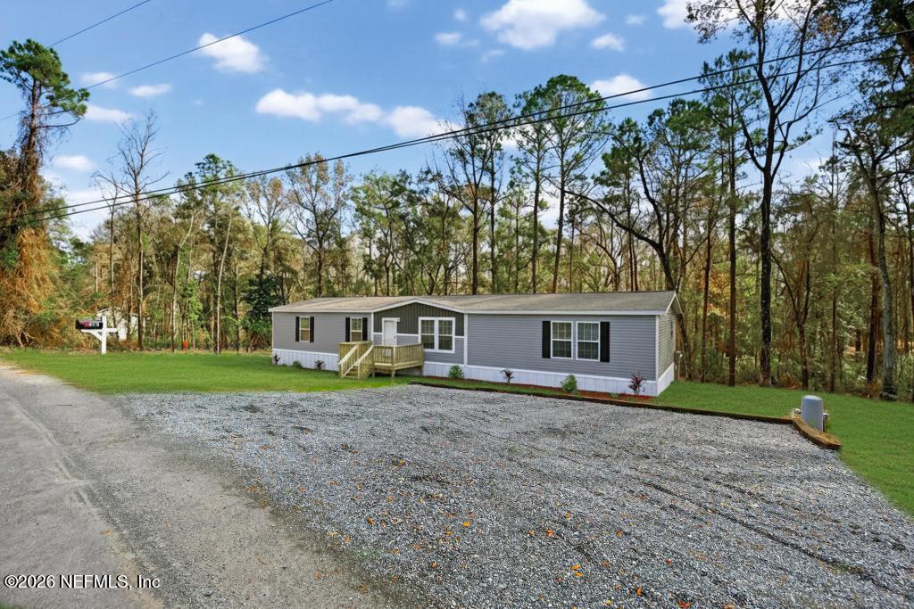 5333 Chicory Circle Middleburg, FL 32068 - Photo 2 of 53 a view of a house with a yard and large trees