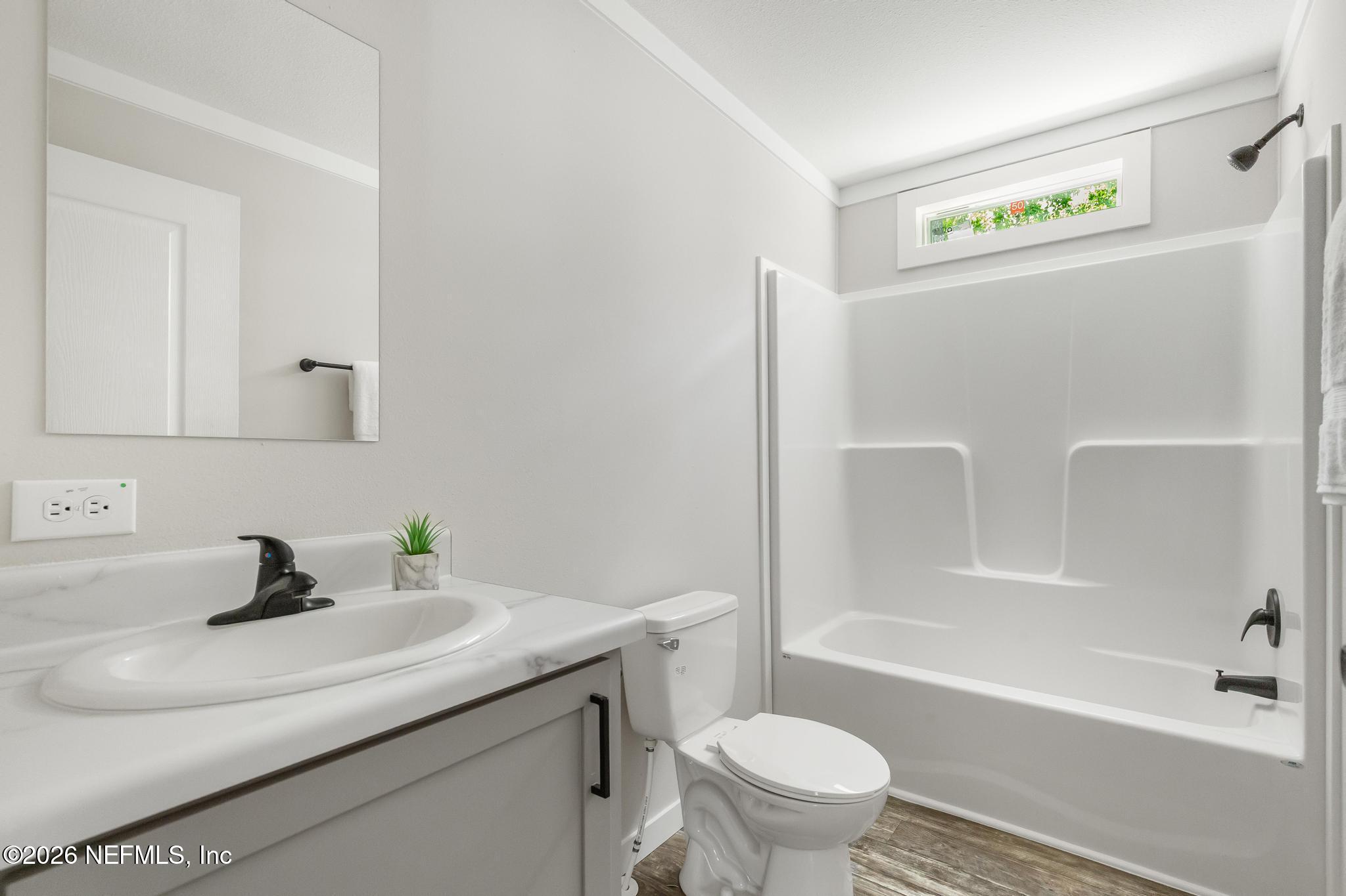 5333 Chicory Circle Middleburg, FL 32068 - Photo 27 of 53 a bathroom with a sink a toilet and a bathtub