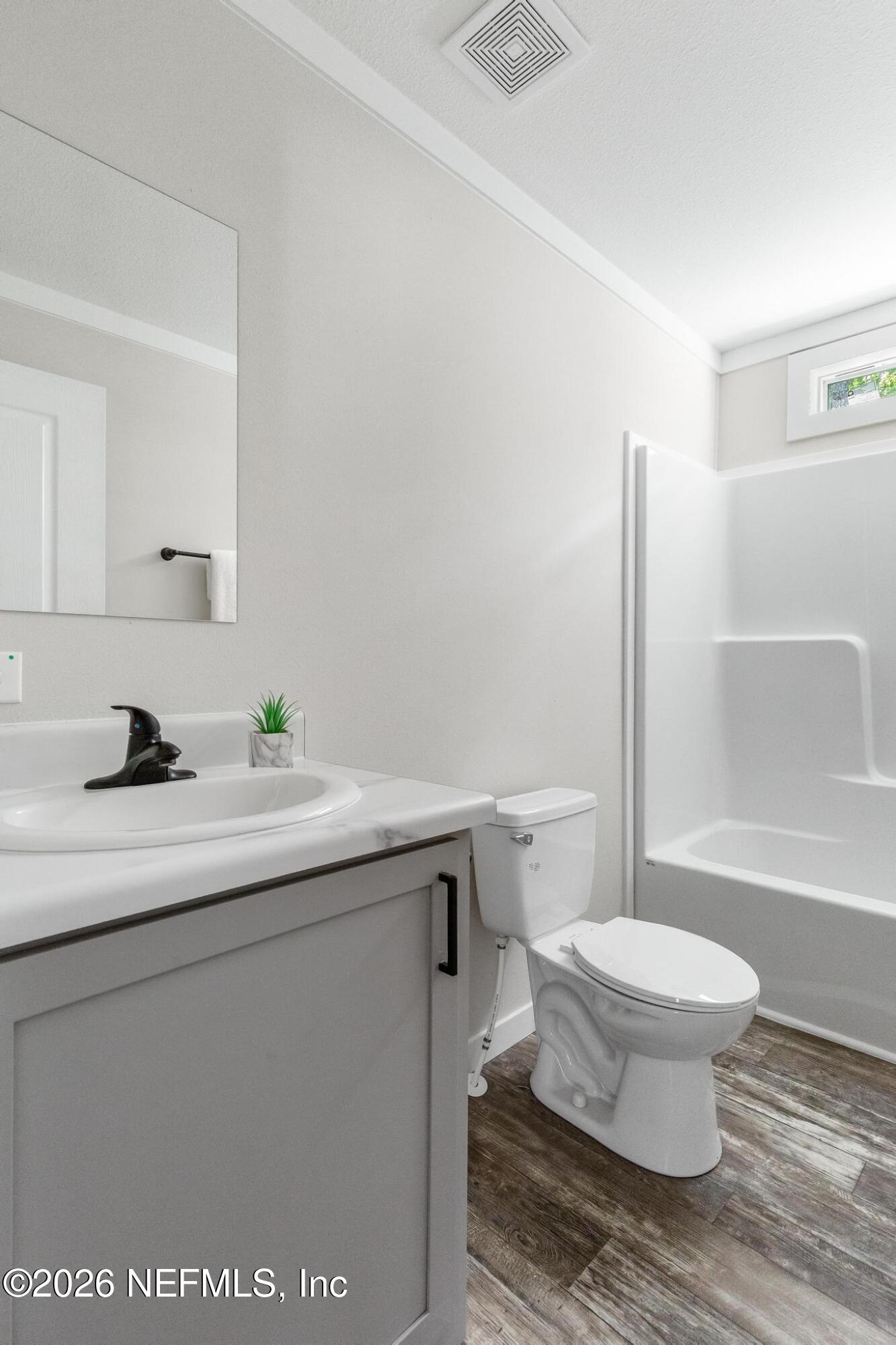 5333 Chicory Circle Middleburg, FL 32068 - Photo 28 of 53 a bathroom with a sink toilet vanity and tub