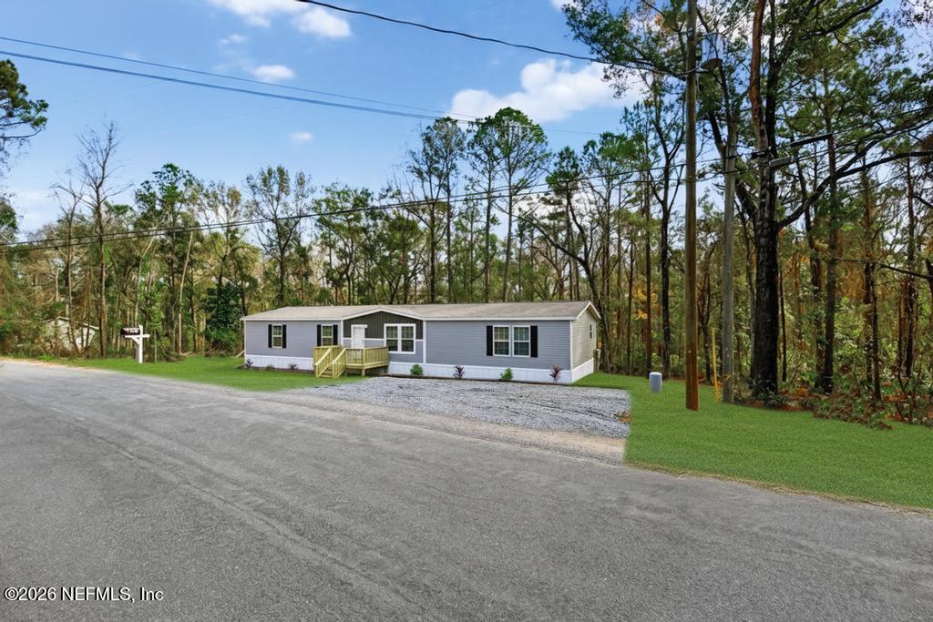 5333 Chicory Circle Middleburg, FL 32068 - Photo 3 of 53 a front view of a house with a yard and garage