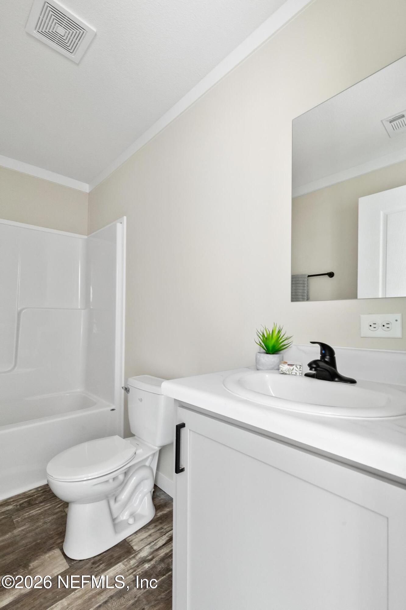 5333 Chicory Circle Middleburg, FL 32068 - Photo 34 of 53 a bathroom with a sink a toilet and a bathtub