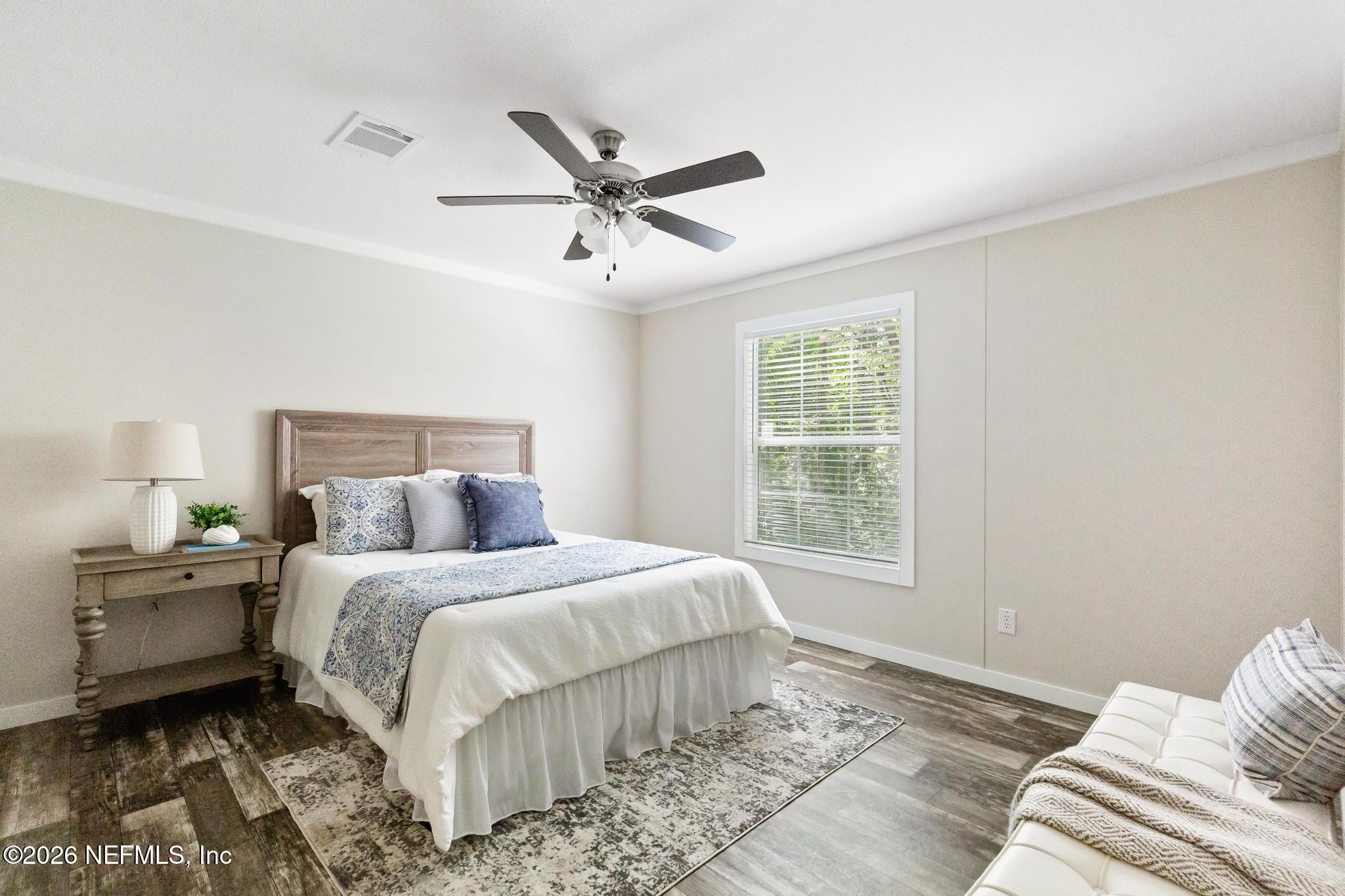 5333 Chicory Circle Middleburg, FL 32068 - Photo 37 of 53 a bedroom with a large bed and a window