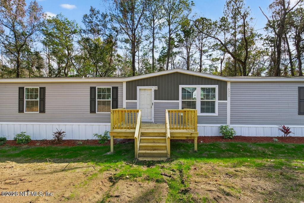 5333 Chicory Circle Middleburg, FL 32068 - Photo 4 of 53 a view of a house with a yard and a large tree