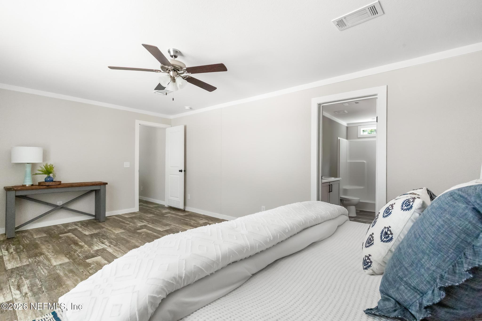 5333 Chicory Circle Middleburg, FL 32068 - Photo 41 of 53 a bedroom with a bed and a table