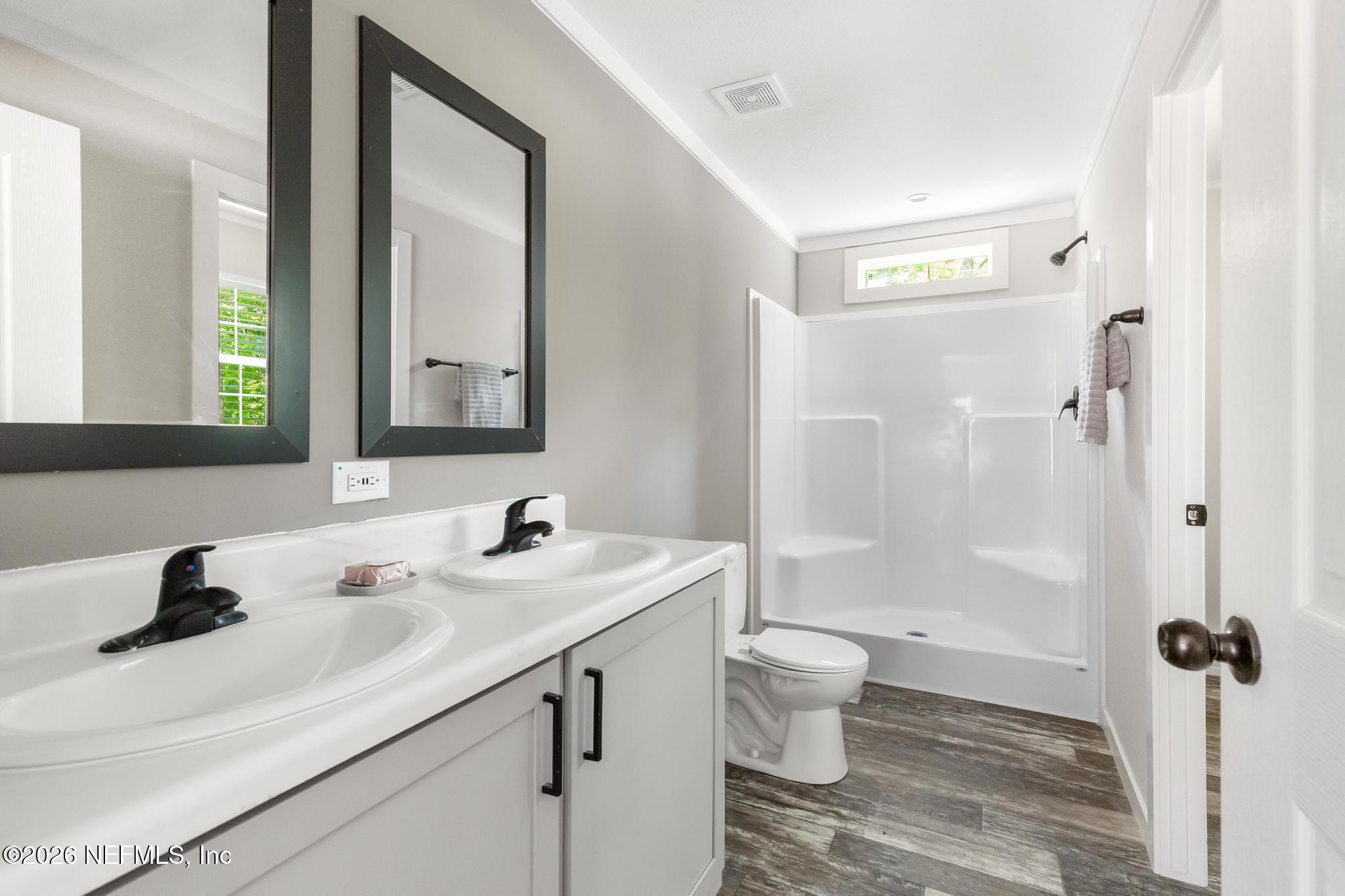 5333 Chicory Circle Middleburg, FL 32068 - Photo 43 of 53 a bathroom with a sink a toilet and a mirror