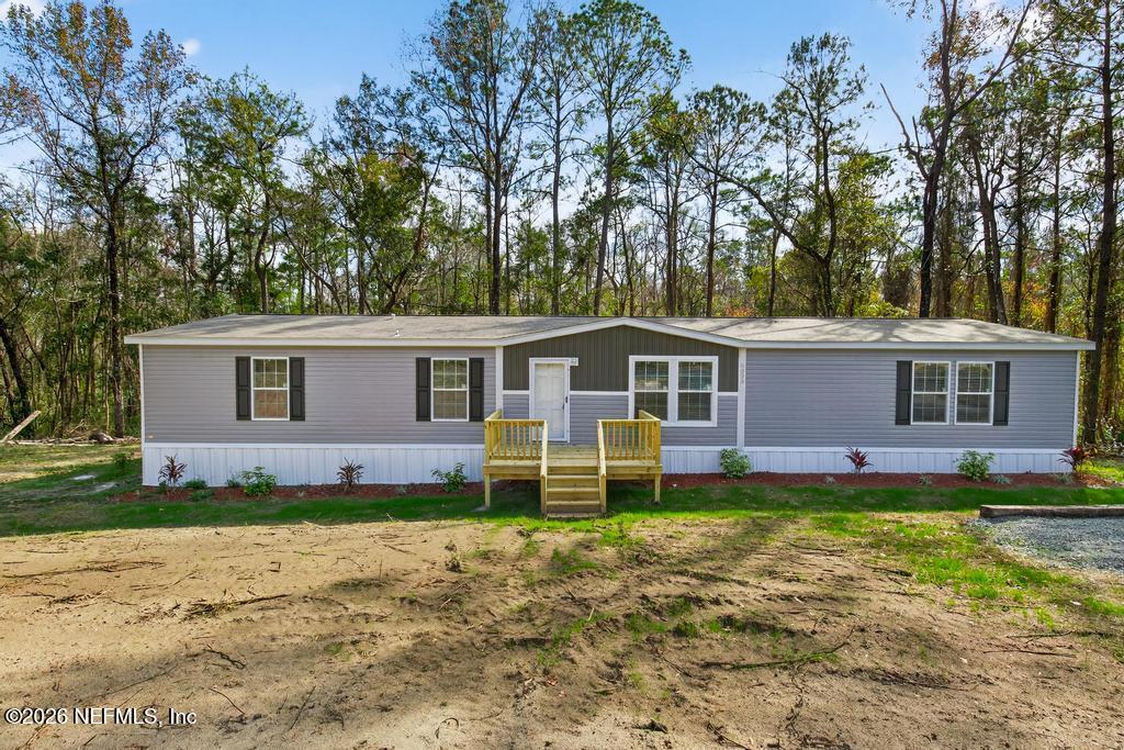 5333 Chicory Circle Middleburg, FL 32068 - Photo 7 of 53 a front view of a house with a yard and trees