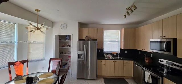 a bathroom with a glass door shower and toilet