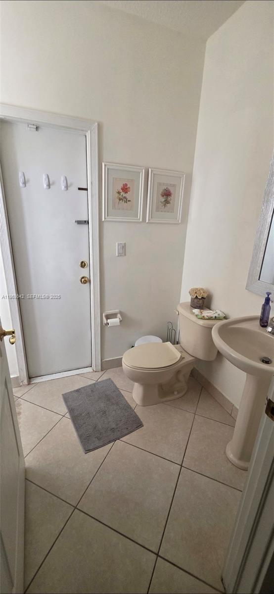 16448 Southwest 67th Terrace Miami, FL 33193 - Photo 18 of 54 a bedroom with a bed and a mirror