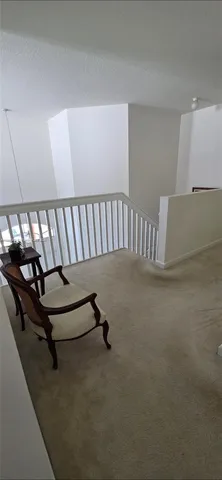 a spacious bedroom with a bed and window