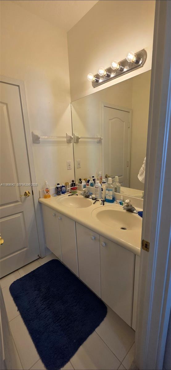 16448 Southwest 67th Terrace Miami, FL 33193 - Photo 28 of 54 a bathroom with a sink and a mirror