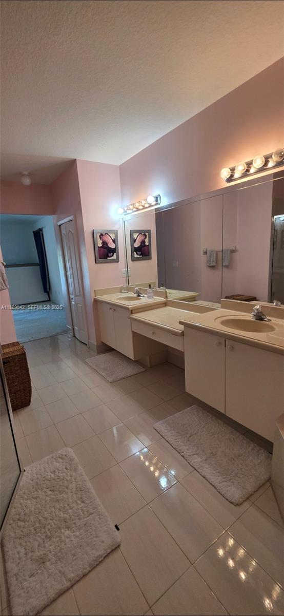 16448 Southwest 67th Terrace Miami, FL 33193 - Photo 34 of 54 a large kitchen with kitchen island a sink stainless steel appliances and cabinets