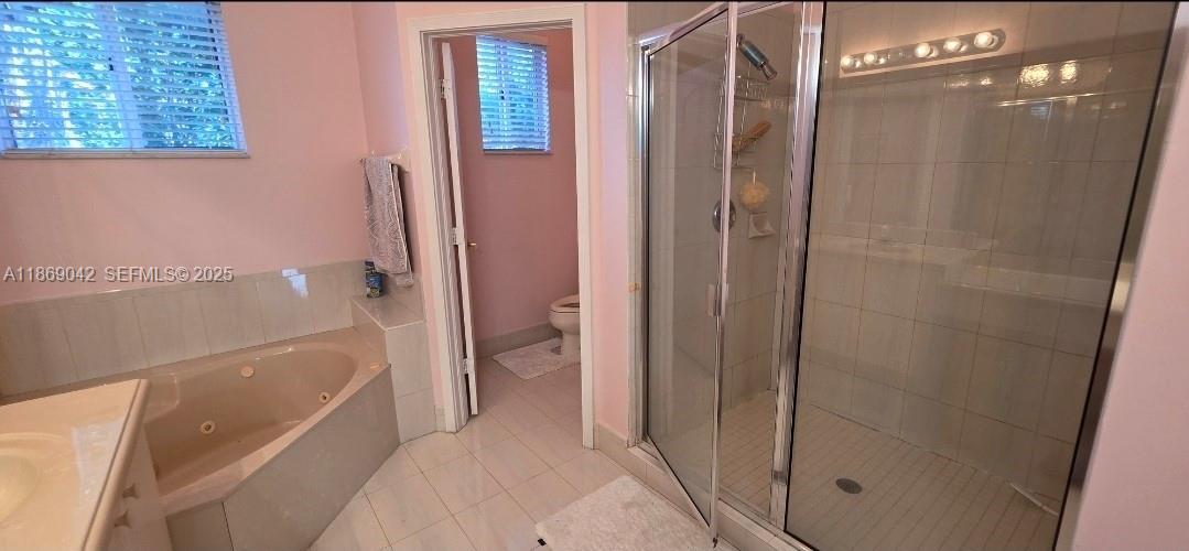 16448 Southwest 67th Terrace Miami, FL 33193 - Photo 37 of 54 a bathroom with a bathtub and a shower