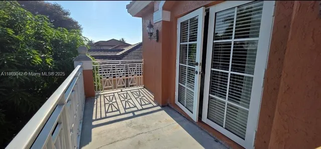 a view of a house with backyard and swimming pool