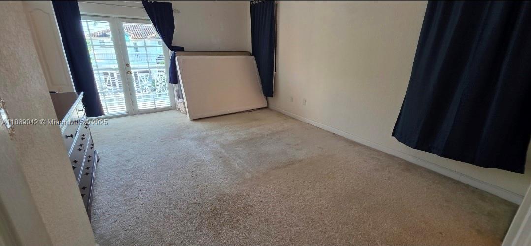 16448 Southwest 67th Terrace Miami, FL 33193 - Photo 40 of 54 a view of an empty room with a window