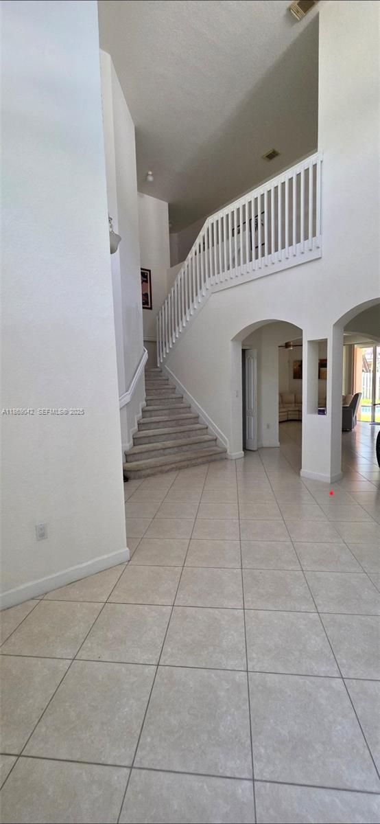 16448 Southwest 67th Terrace Miami, FL 33193 - Photo 4 of 54 a view of entryway and hall with a window