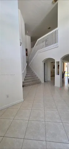 a view of entryway and hall with a window