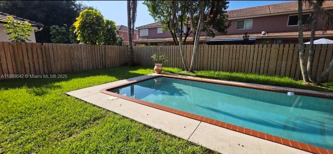 16448 Southwest 67th Terrace Miami, FL 33193 - Photo 47 of 54 a view of backyard with wooden fence and large trees