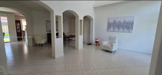 a living room with furniture and a table