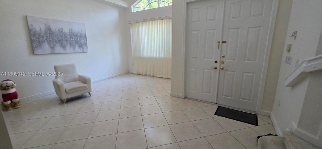 16448 Southwest 67th Terrace Miami, FL 33193 - Photo 7 of 54 a living room with furniture and a window