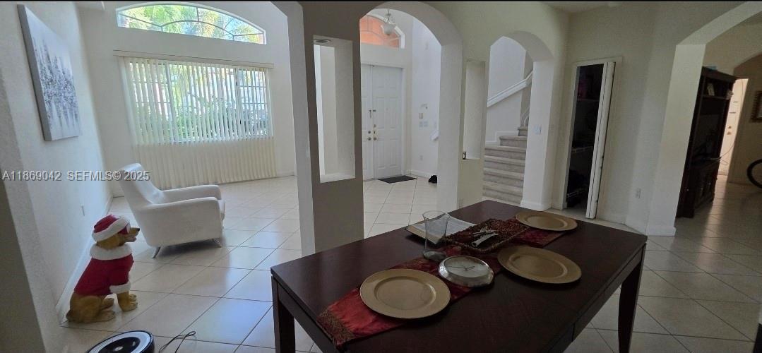 16448 Southwest 67th Terrace Miami, FL 33193 - Photo 9 of 54 a dining room with furniture and wooden floor