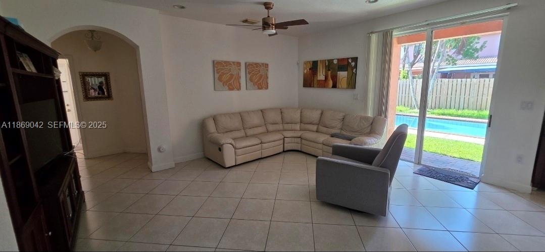 16448 Southwest 67th Terrace Miami, FL 33193 - Photo 10 of 54 a living room with furniture and a window