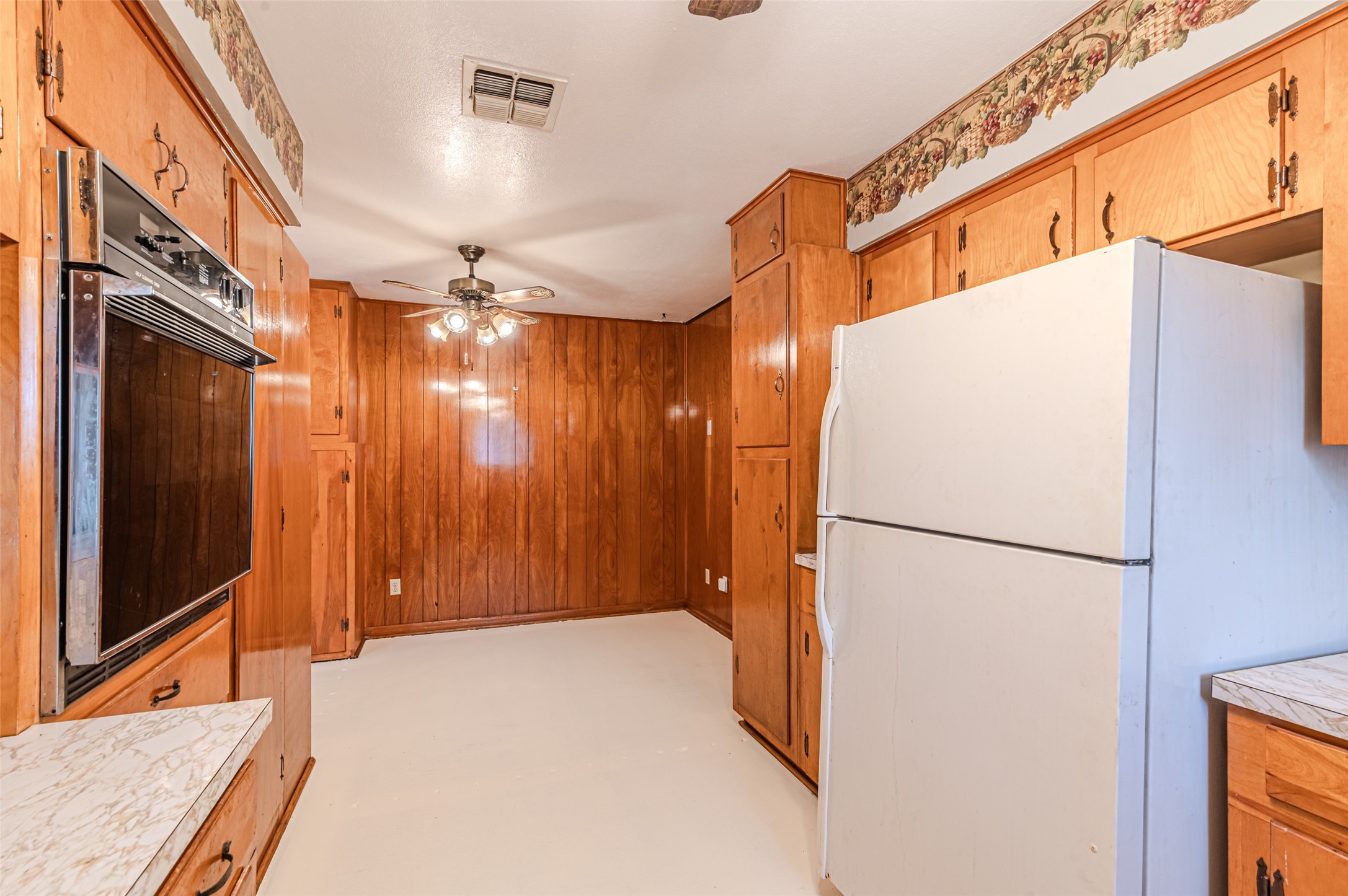 1126 10th Street Hempstead, TX 77445 - Photo 13 of 34 a view of a hallway with a refrigerator