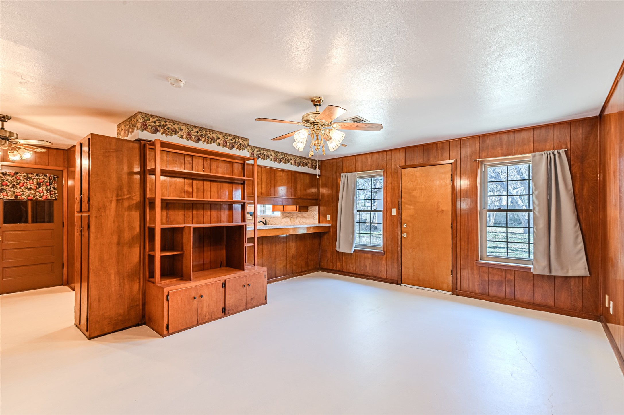 1126 10th Street Hempstead, TX 77445 - Photo 19 of 34 a view of an empty room with window and cabinet