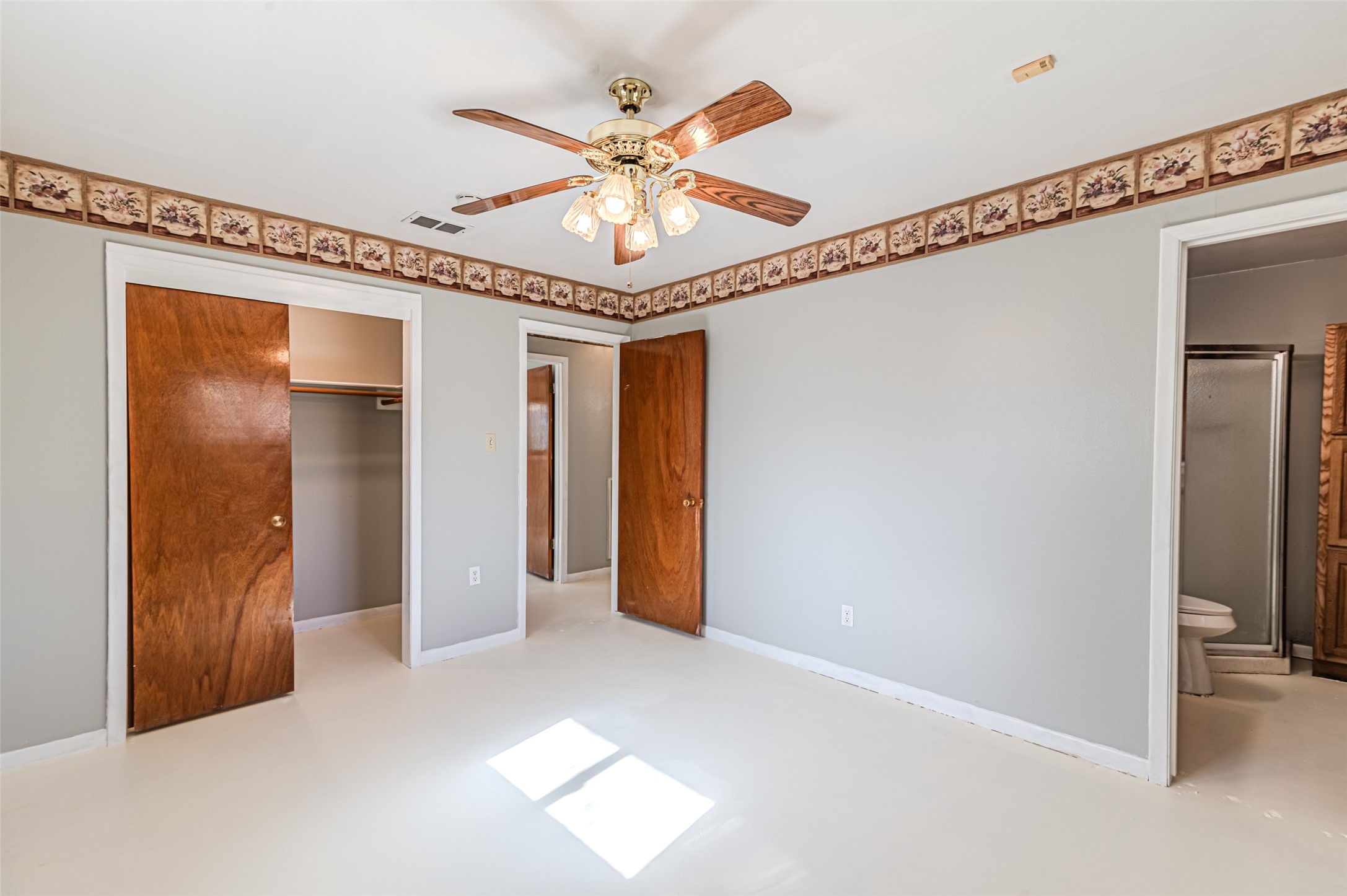 1126 10th Street Hempstead, TX 77445 - Photo 32 of 34 a view of a livingroom with a hallway and a ceiling fan