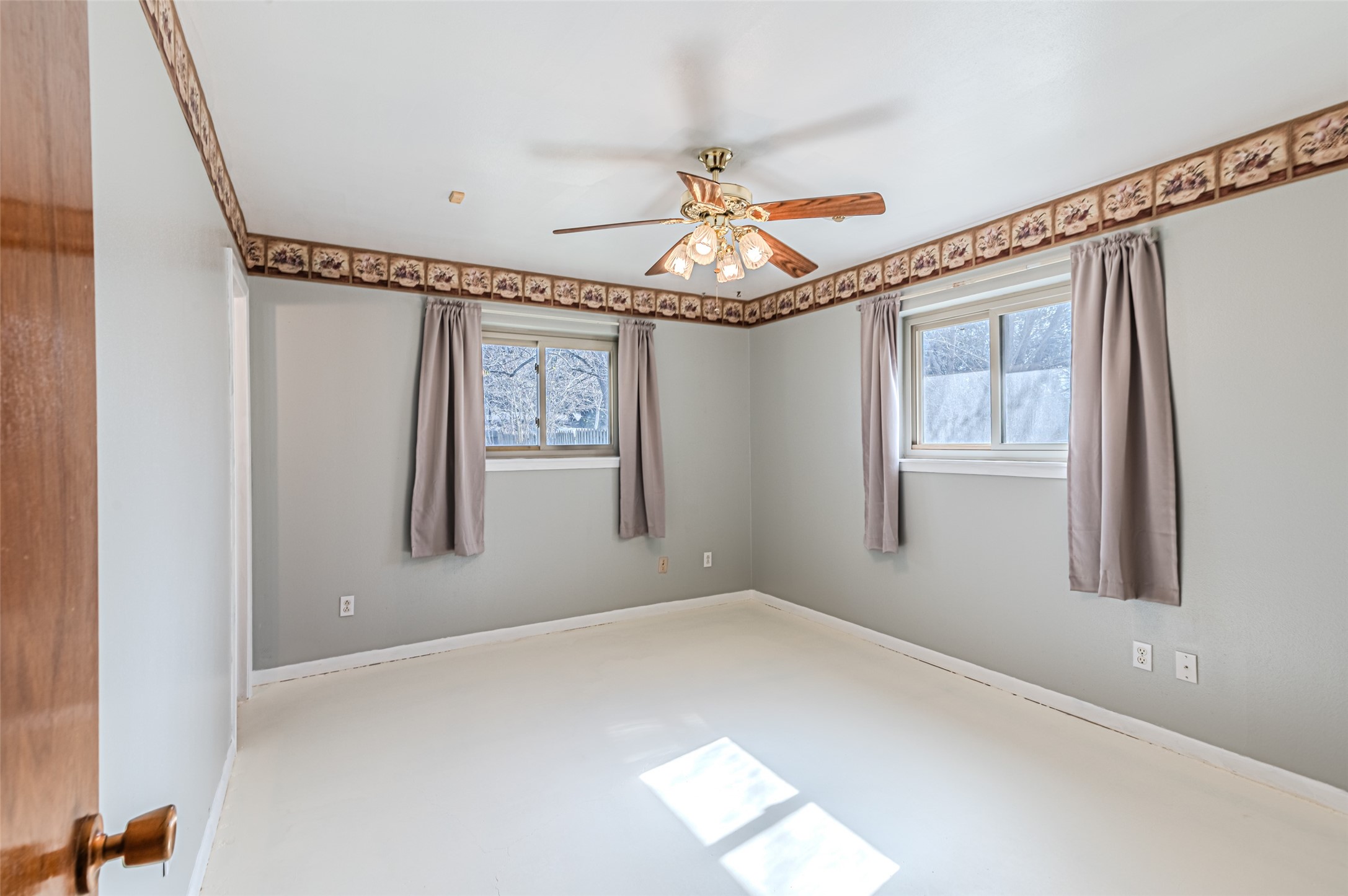 1126 10th Street Hempstead, TX 77445 - Photo 34 of 34 a view of empty room with wooden floor and fan