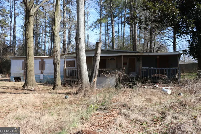a view of house with trees in the background