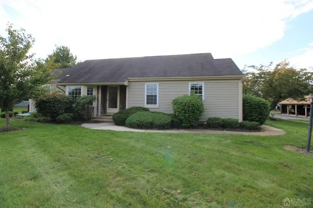 a house view with a garden space