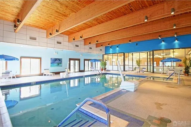 a view of a swimming pool with a patio