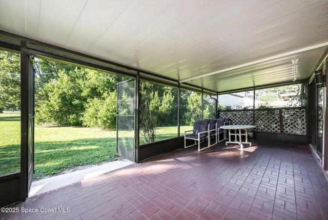 a view of a room with a large window