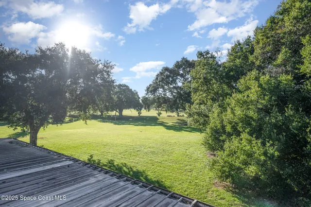 a view of a swimming pool with an outdoor space and seating area