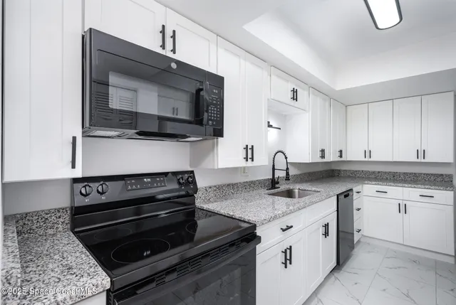 a kitchen with a stove and a microwave