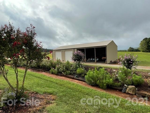845 Sandy Level Church Road Bostic, NC 28018 - Photo 2 of 46 a front view of a house with garden