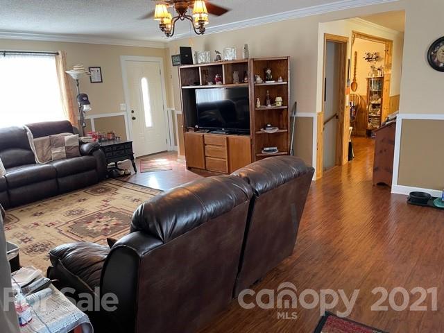845 Sandy Level Church Road Bostic, NC 28018 - Photo 11 of 46 a living room with furniture and a flat screen tv