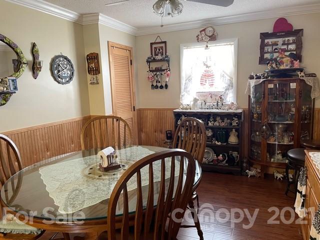 845 Sandy Level Church Road Bostic, NC 28018 - Photo 17 of 46 a view of a dining room with furniture window and wooden floor