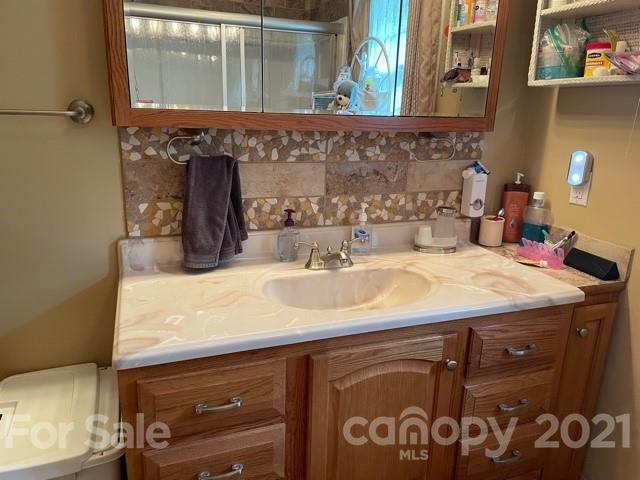 845 Sandy Level Church Road Bostic, NC 28018 - Photo 20 of 46 a bathroom with a sink and a mirror