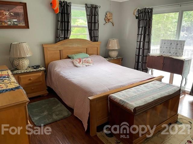 845 Sandy Level Church Road Bostic, NC 28018 - Photo 23 of 46 a bedroom with a bed and wooden floor