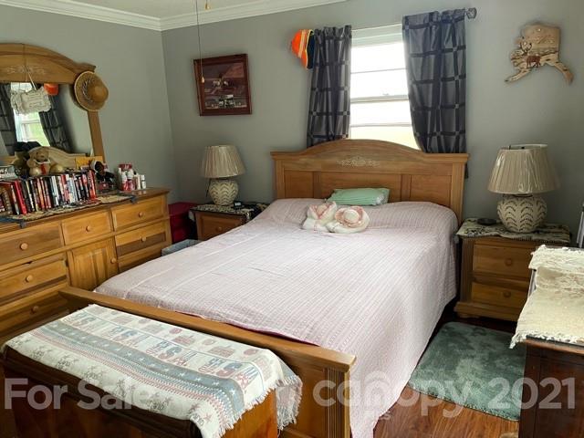 845 Sandy Level Church Road Bostic, NC 28018 - Photo 25 of 46 a bedroom with a bed and wooden floor