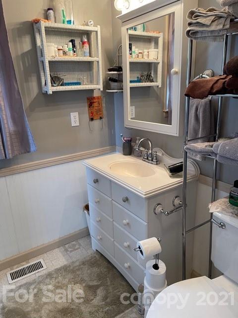845 Sandy Level Church Road Bostic, NC 28018 - Photo 26 of 46 a bathroom with a sink toilet and a mirror
