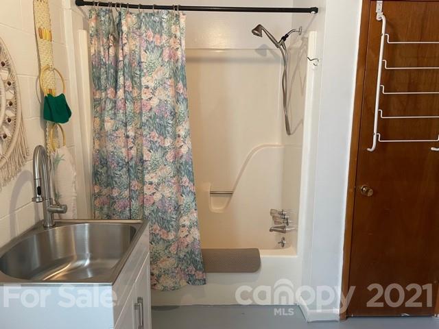 845 Sandy Level Church Road Bostic, NC 28018 - Photo 33 of 46 a bathroom with a tub and shower