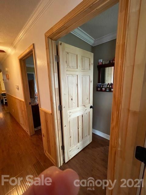 845 Sandy Level Church Road Bostic, NC 28018 - Photo 38 of 46 a view of a hallway with wooden floor and closet