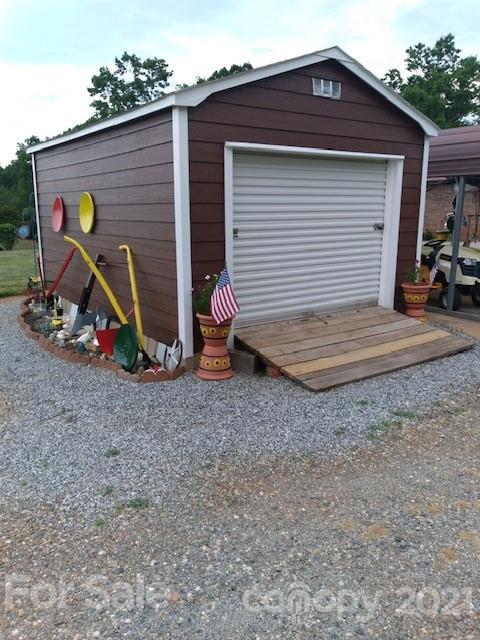 845 Sandy Level Church Road Bostic, NC 28018 - Photo 6 of 46 a view of a house with a yard and lawn chairs